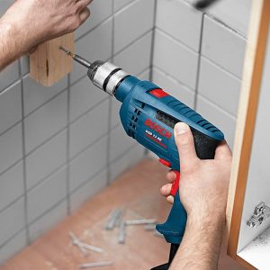Máy khoan động lực Bosch GSB 10 RE  (valy nhựa, bộ mũi khoan + đầu vít)